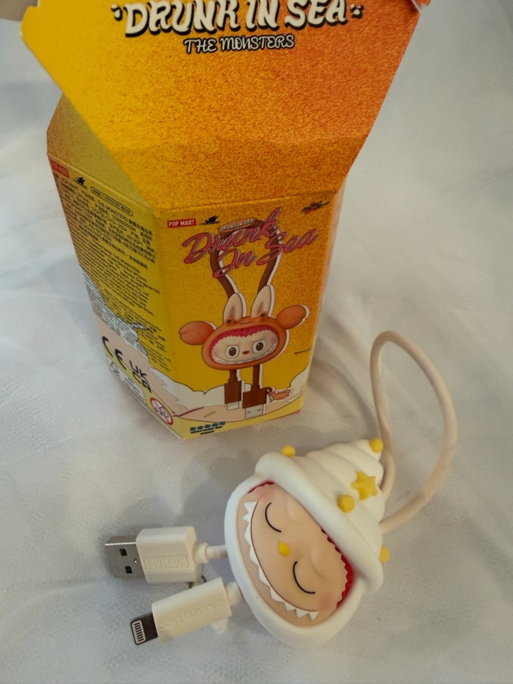 Pop Mart "Drunk in Sea" iPhone Charging Cable - Conch